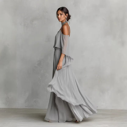 Women's light gray chiffon cold-shoulder maxi dress with spaghetti straps and ruffled overlay, front view – Blutiful