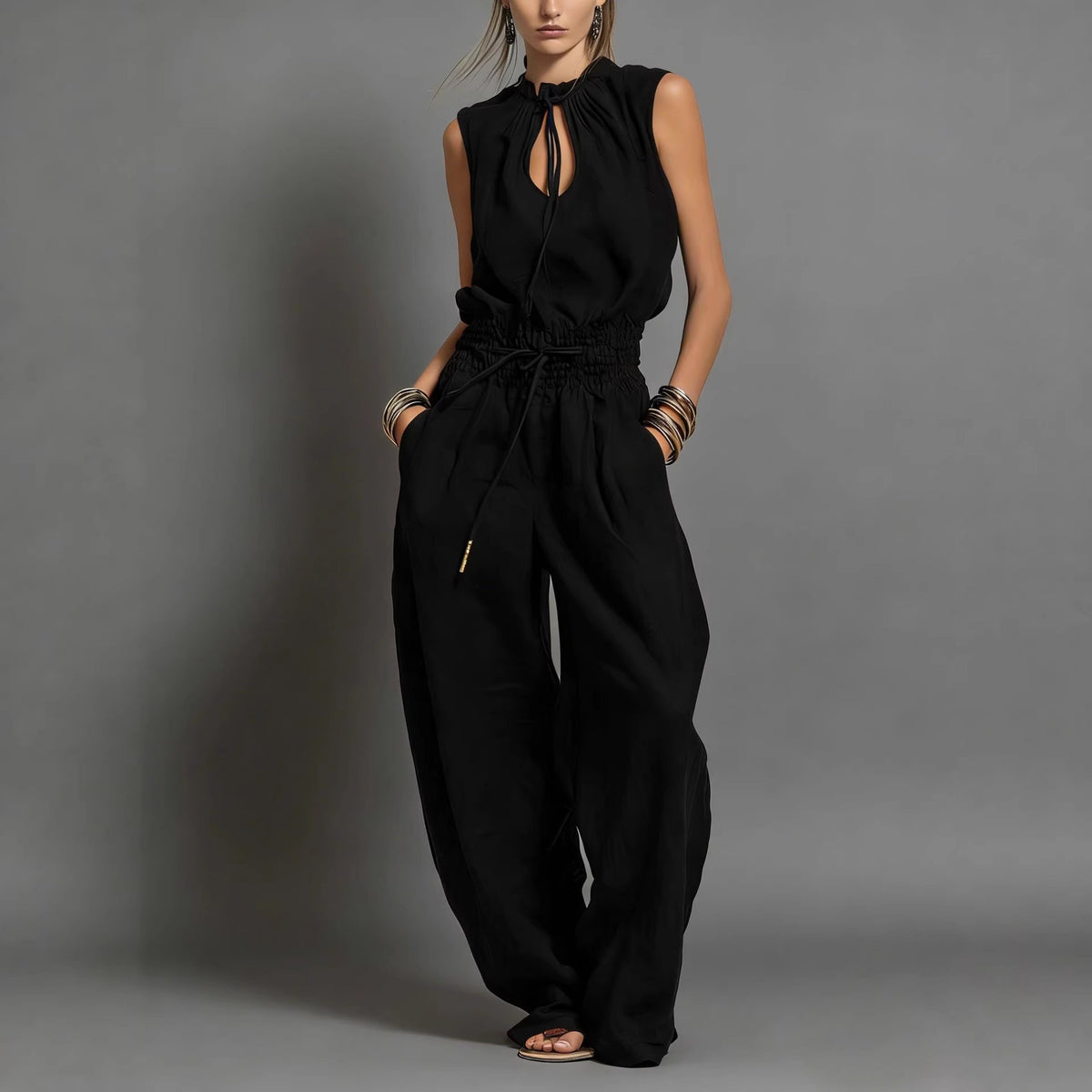 Women's black sleeveless wide-leg jumpsuit with keyhole neckline and drawstring waist – Blutiful
